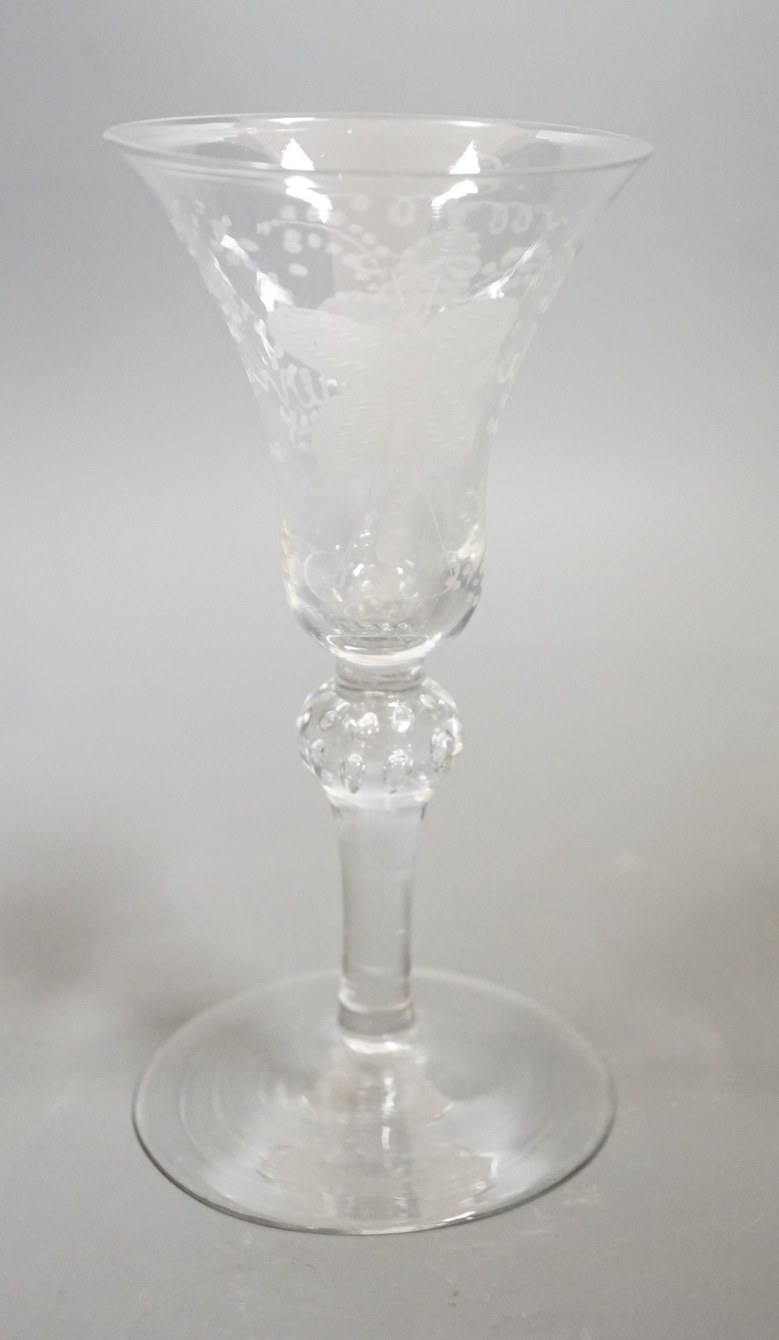An 18th century Newcastle type baluster wine glass, 18cms high